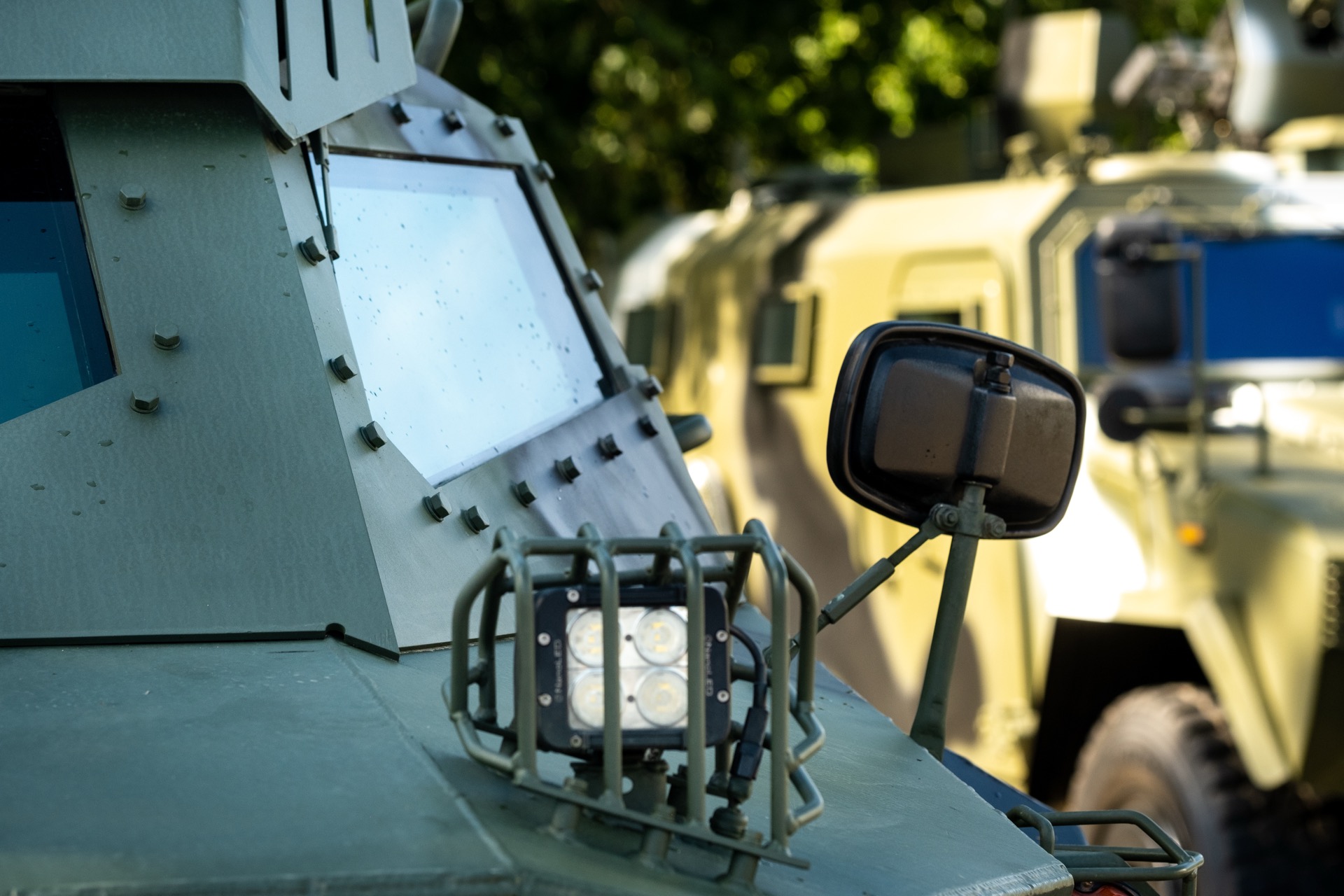 Armored cash-in-transit vehicle with KDS secure fleet tracking